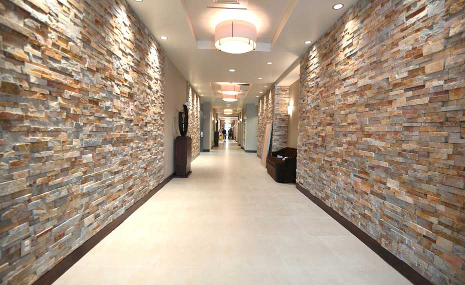 Gold Stacked Stacked Stone Walls in Hallway of Hotel