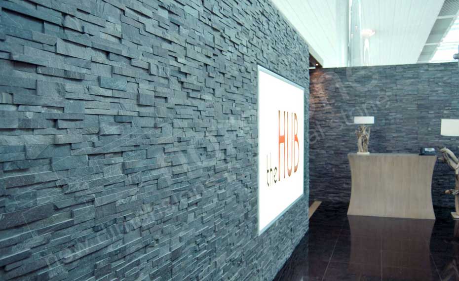 Natural Stacked Stone Veneer Example on Interior Wall using Norstone Charcoal Rock Panels