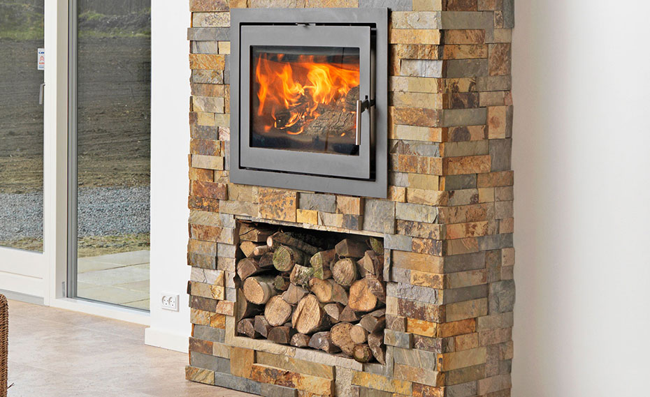 Elegant multicolored Stone Veneer Fireplace creates warmth for an outdoor patio.