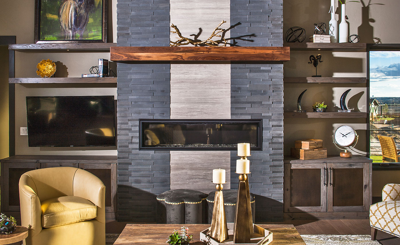 Norstone's AKSENT 3D Panels in Grey Basalt adorn this modern fireplace with haisa marble strip down the center