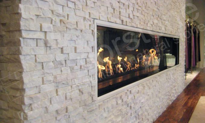 white stacked stone fireplace